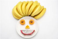 Photo of a plate with fruit and bananas