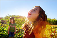 Photo of girls playing in bright sunlight